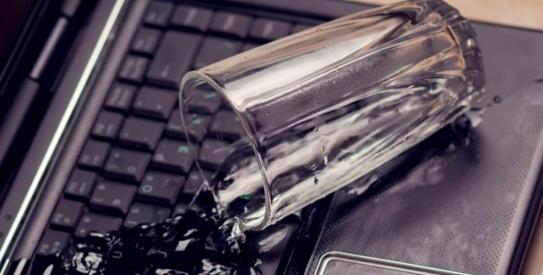 Glass spilled over on laptop keyboard
