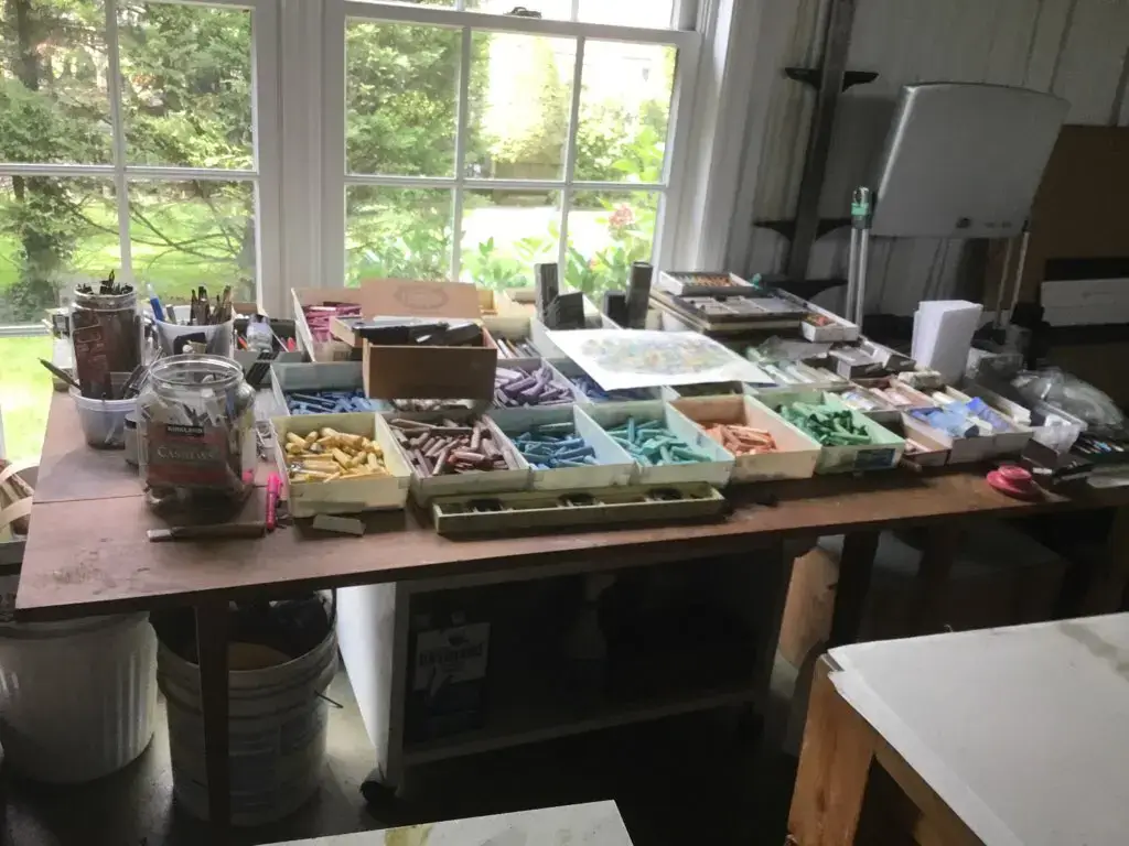 Home art studio with organized pastels