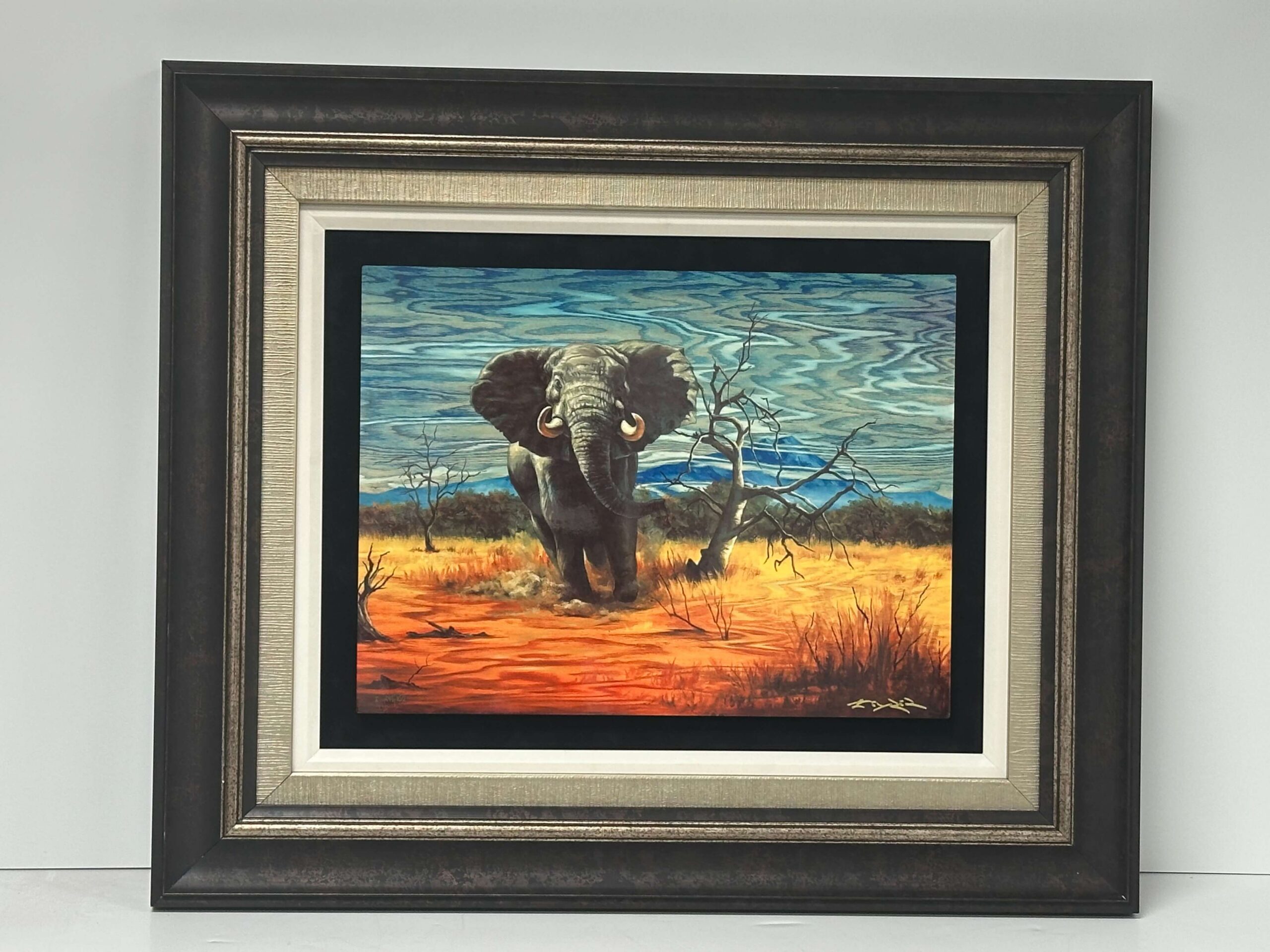 Elephant painting after professional conservation cleaning and reframing by Prism Specialties Columbus