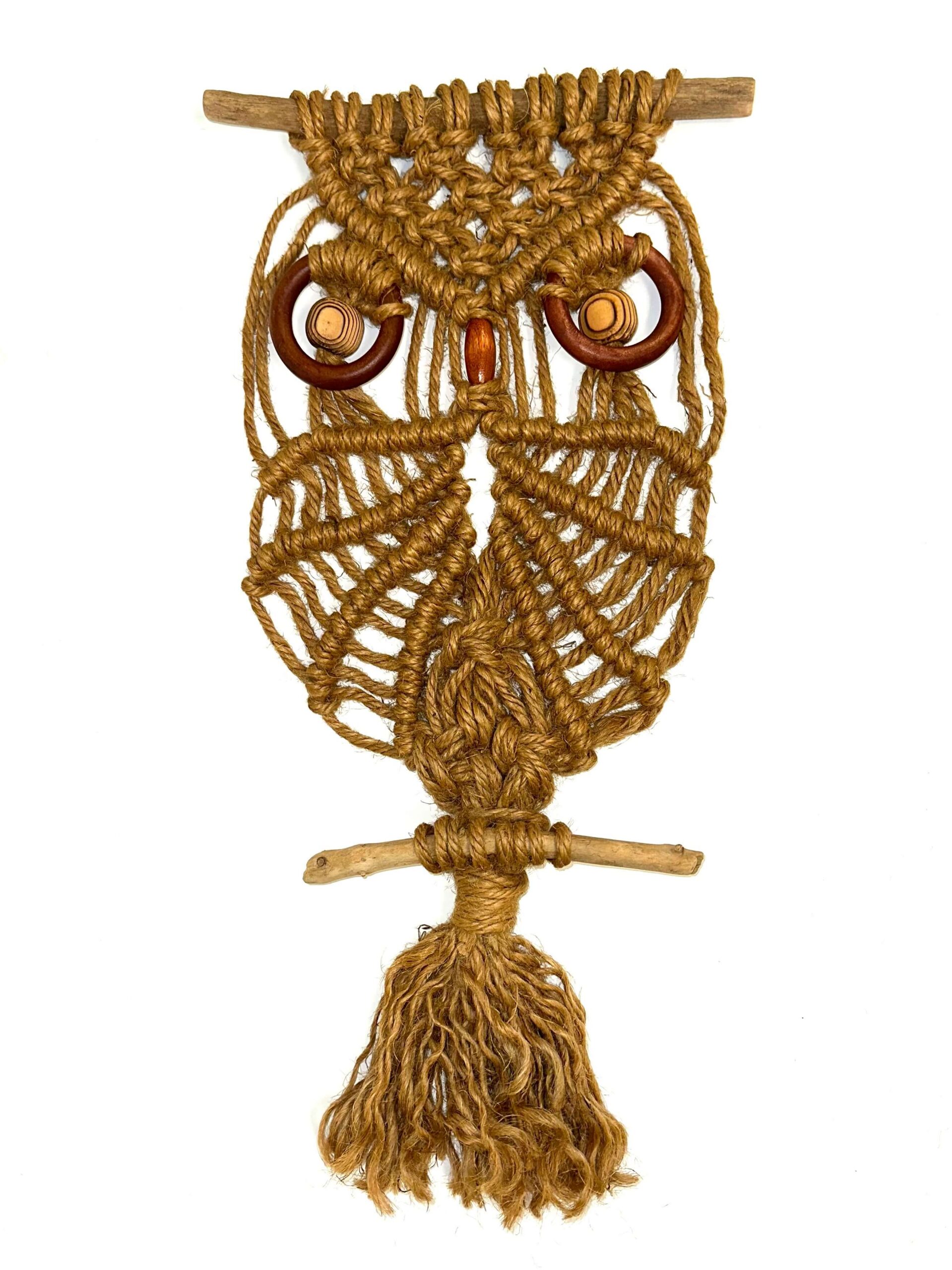 Macrame owl wall hanging before repair showing broken cords, compressed fibers, accumulated dust, and lost form