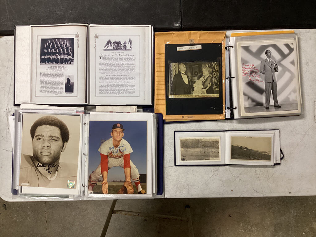 Vintage sports memorabilia photos and collectibles archive organized after restoration work