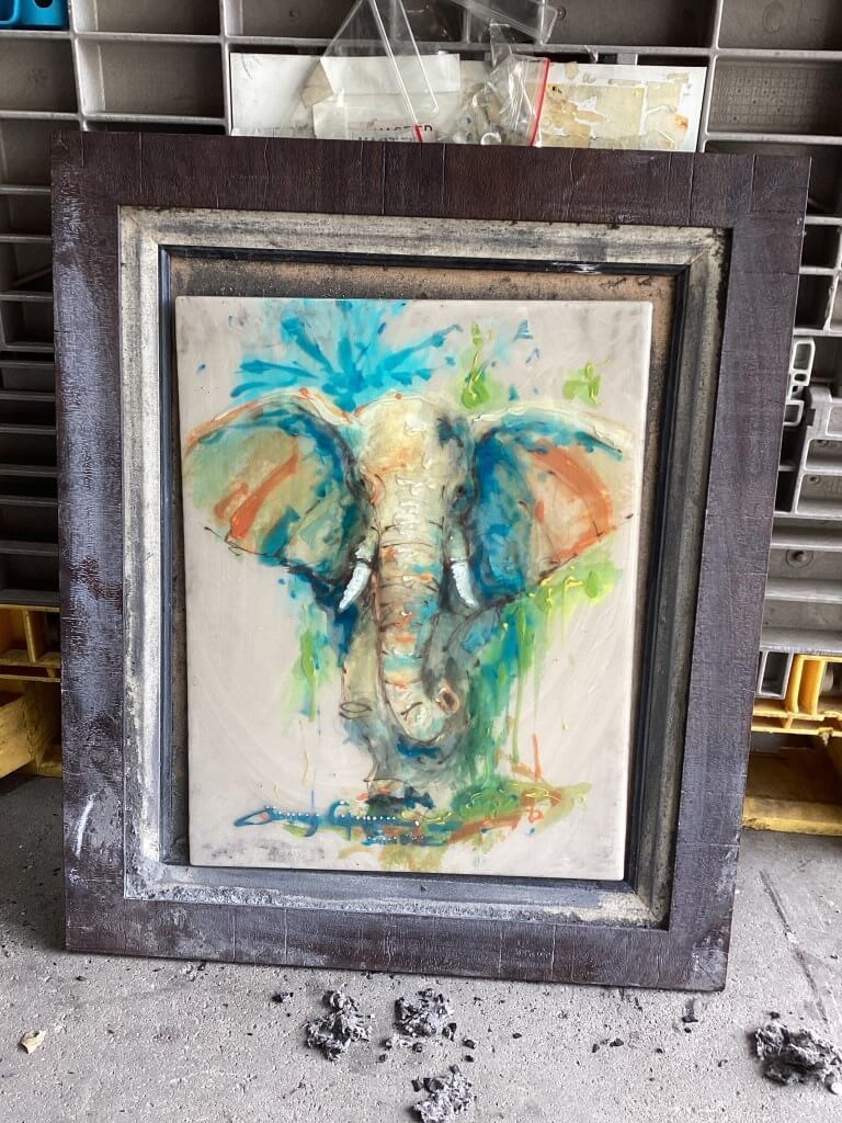 Watercolor elephant painting before restoration showing surface staining and pigment loss