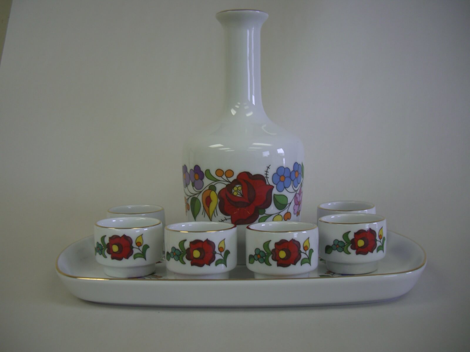 Hand-painted Hungarian porcelain decanter set after full restoration by Prism Specialties