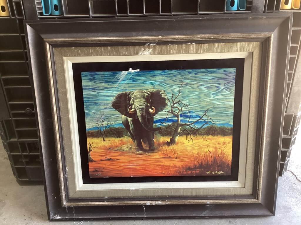 Elephant painting showing water exposure damage before professional restoration
